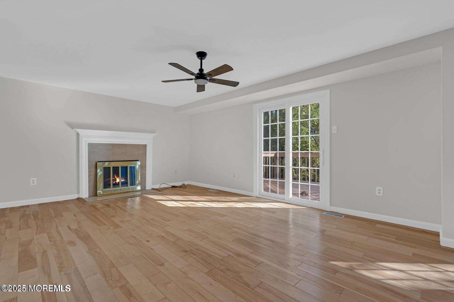 58 Garden Avenue Island Heights, NJ 08732 - Photo 9 of 46 a view of an empty room with a window and wooden floor