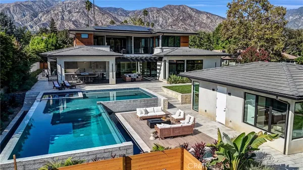 a front view of a house with a yard table and chairs