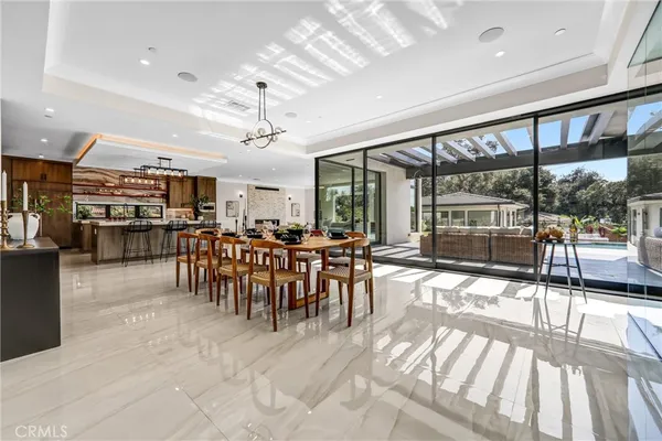 a kitchen with a sink window and cabinets