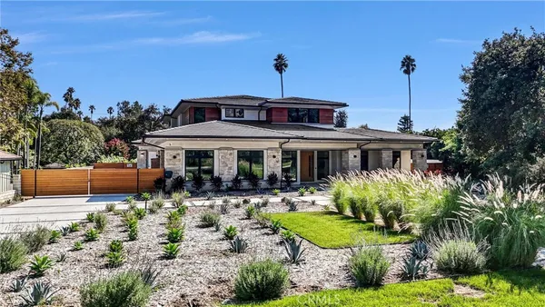 a front view of a house with garden