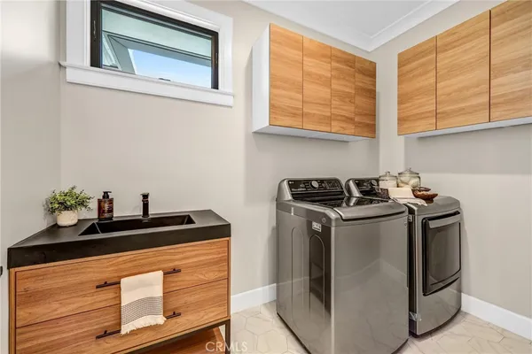 a living room with furniture and view of kitchen