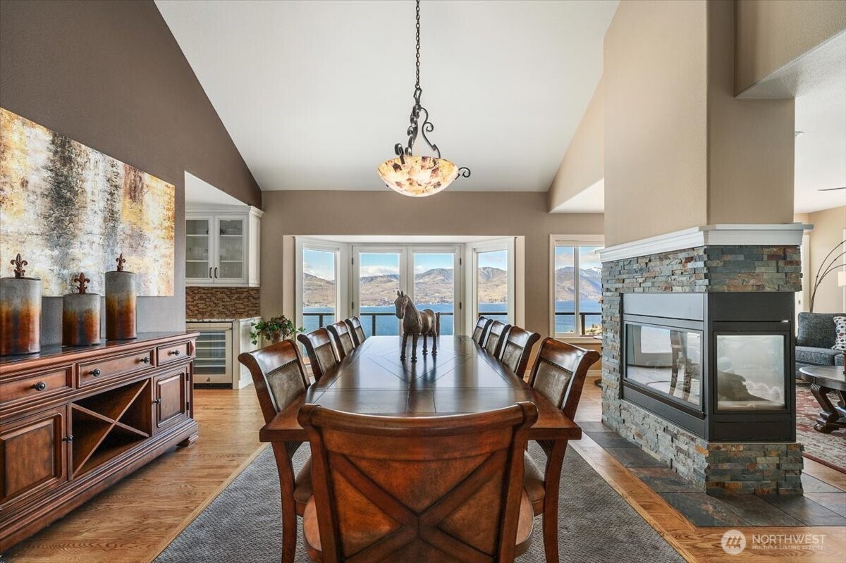 333 Highpoint Place Chelan, WA 98816 - Photo 11 of 40 a view of a dining room with furniture window and wooden floor