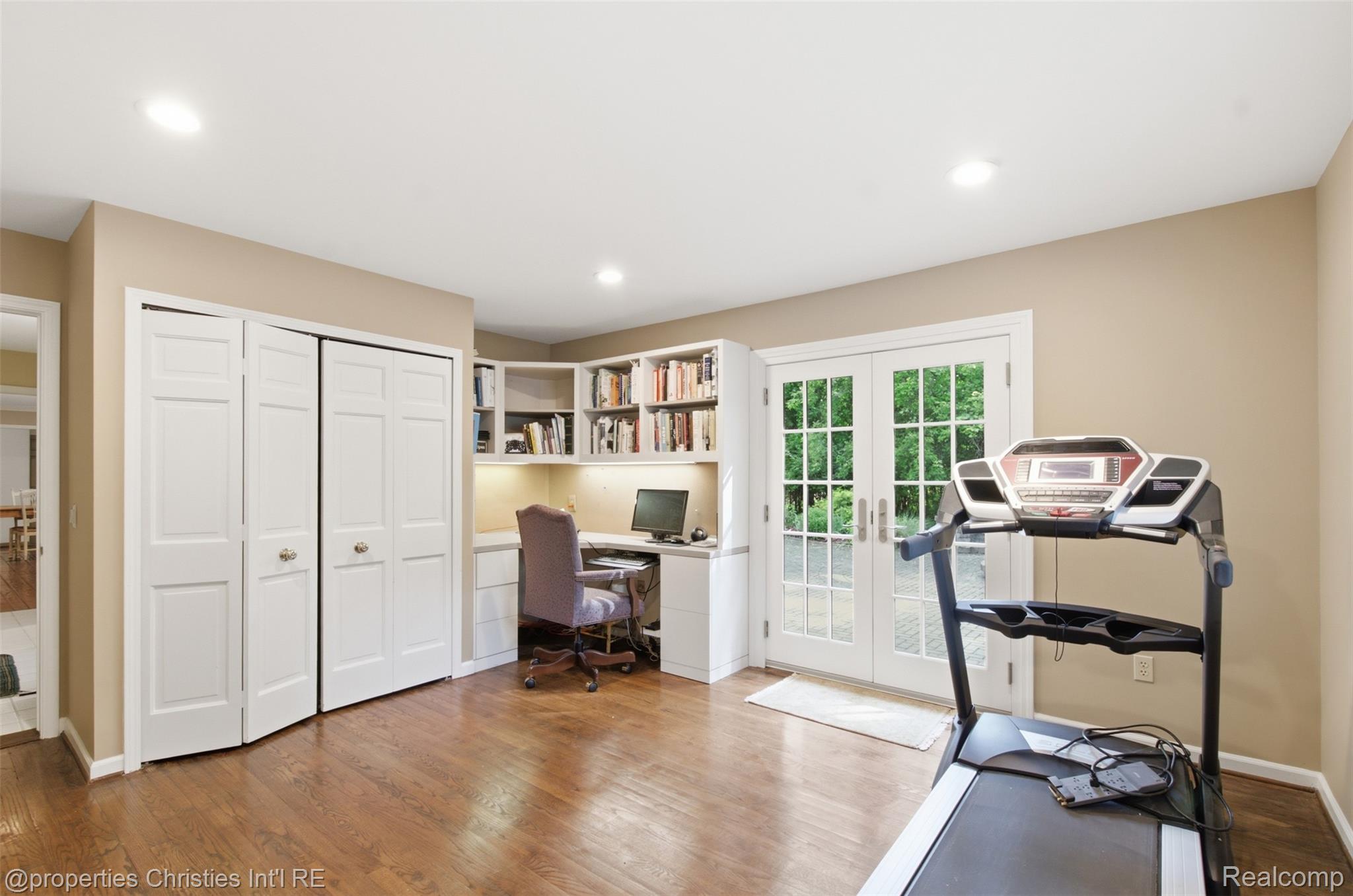 25235 Canterbury Road Franklin, MI 48025 - Photo 22 of 56 First floor room that could be used as a bedroom, office, exercise room or cabana room if you put in a pool in the backyard. French doors lead to rear paver patio