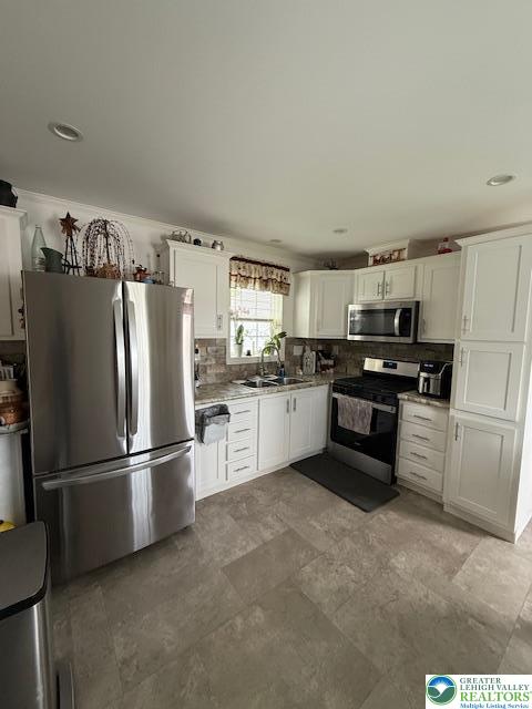 7468 Continental Circle Trexlertown, PA 18087 - Photo 5 of 13 a kitchen with granite countertop stainless steel appliances and refrigerator