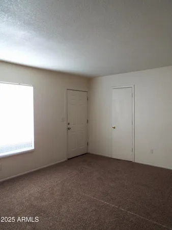 a kitchen with a refrigerator and a stove
