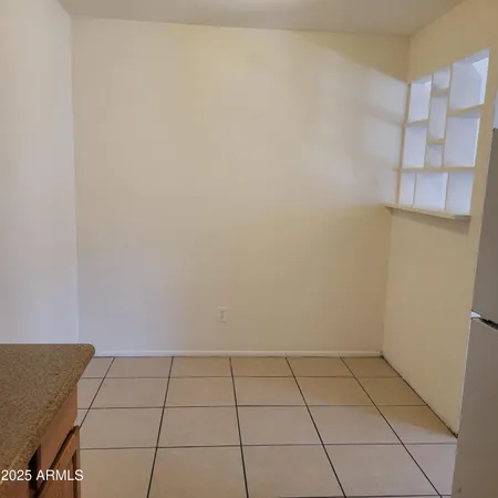 a view of an empty room and a window