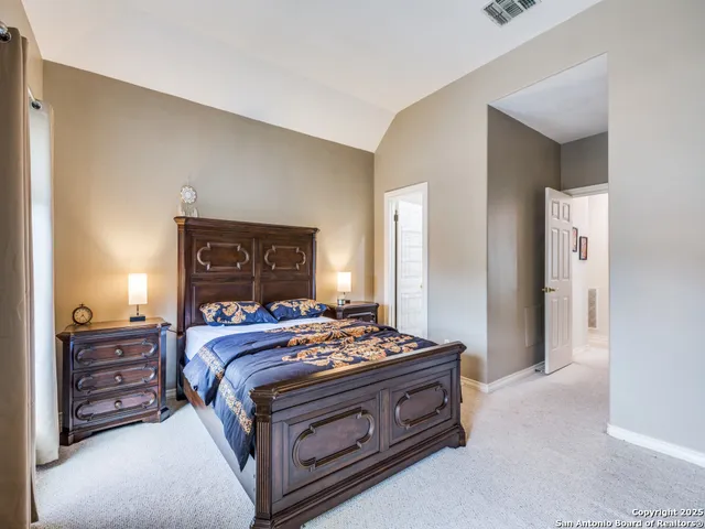 a bedroom with a bed and a dresser