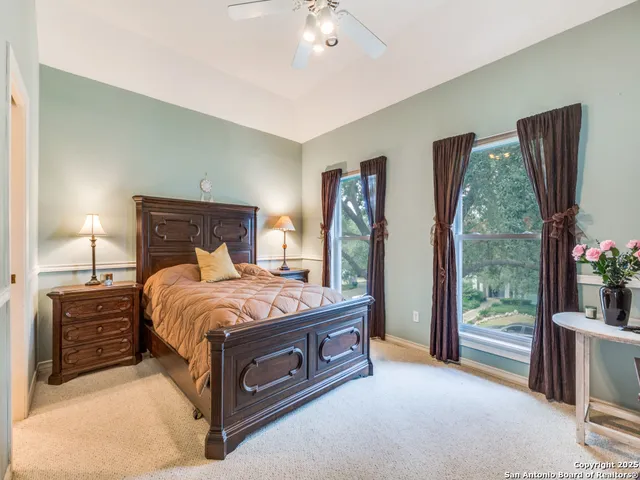 a bed sitting in a room next to a window