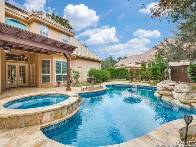 a view of a swimming pool with lounge chair