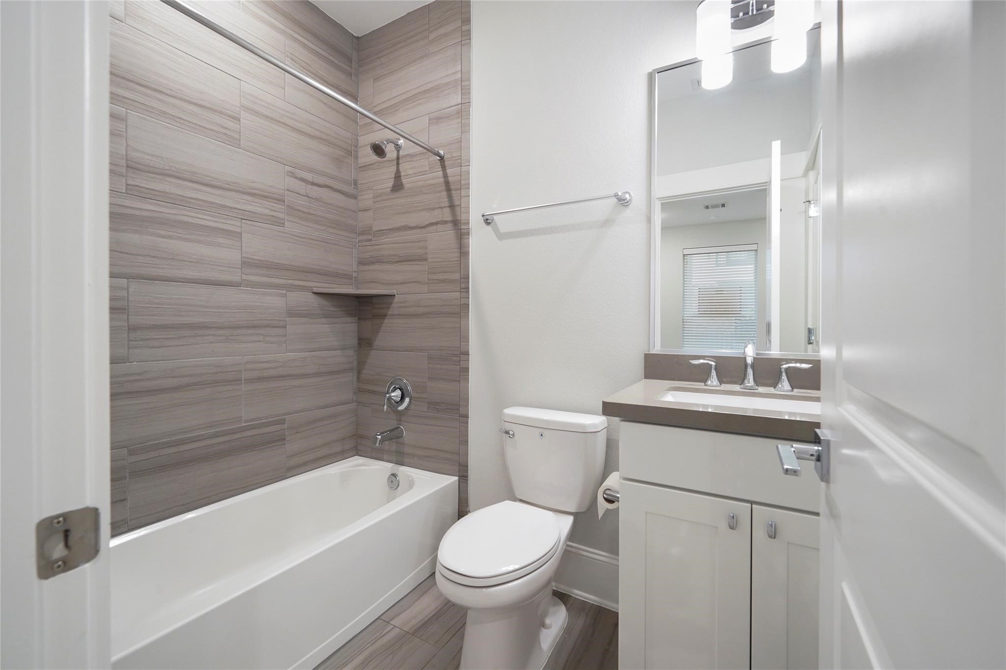 1268 North Post Oak Road, Unit A Houston, TX 77055 - Photo 16 of 32 a bathroom with a sink a toilet and shower