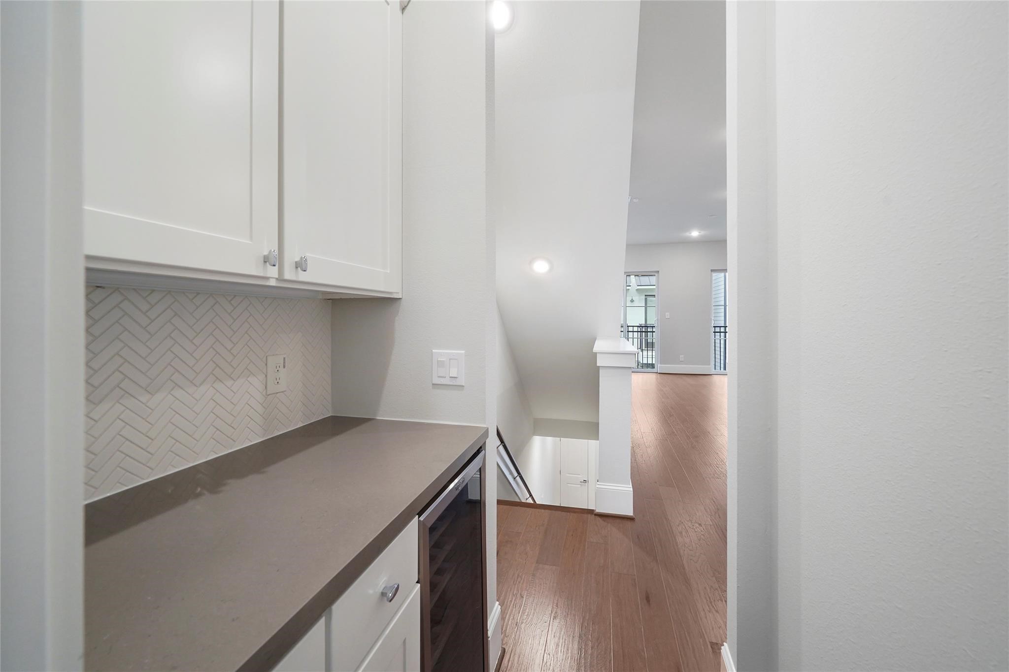 1268 North Post Oak Road, Unit A Houston, TX 77055 - Photo 19 of 32 a view of cabinets and wooden floor