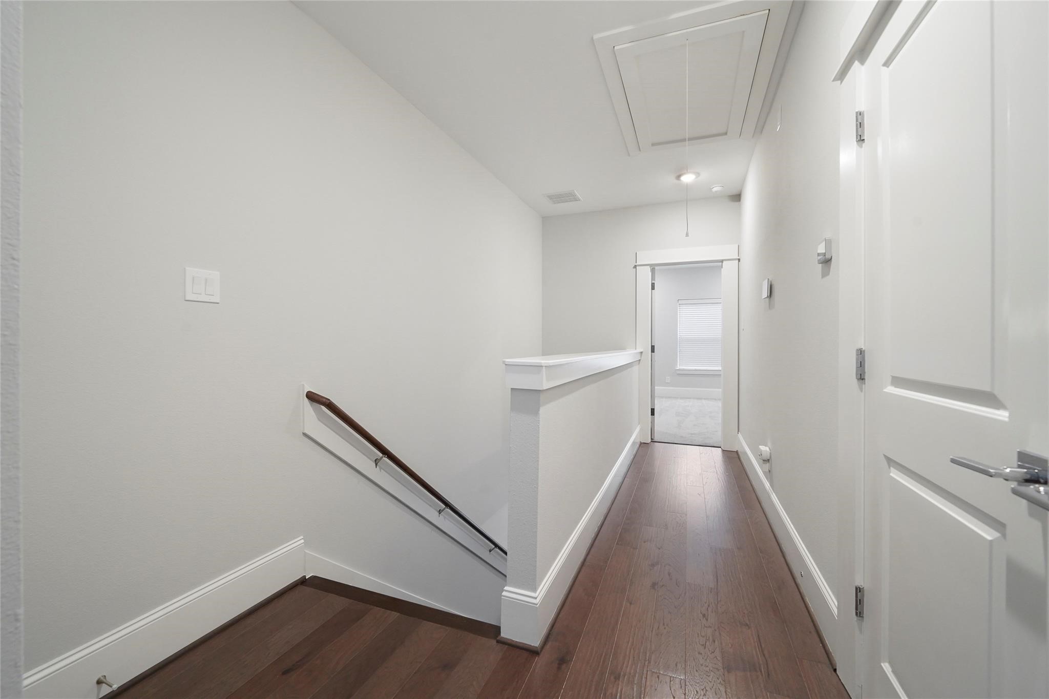 1268 North Post Oak Road, Unit A Houston, TX 77055 - Photo 23 of 32 a view of a hallway with wooden floor