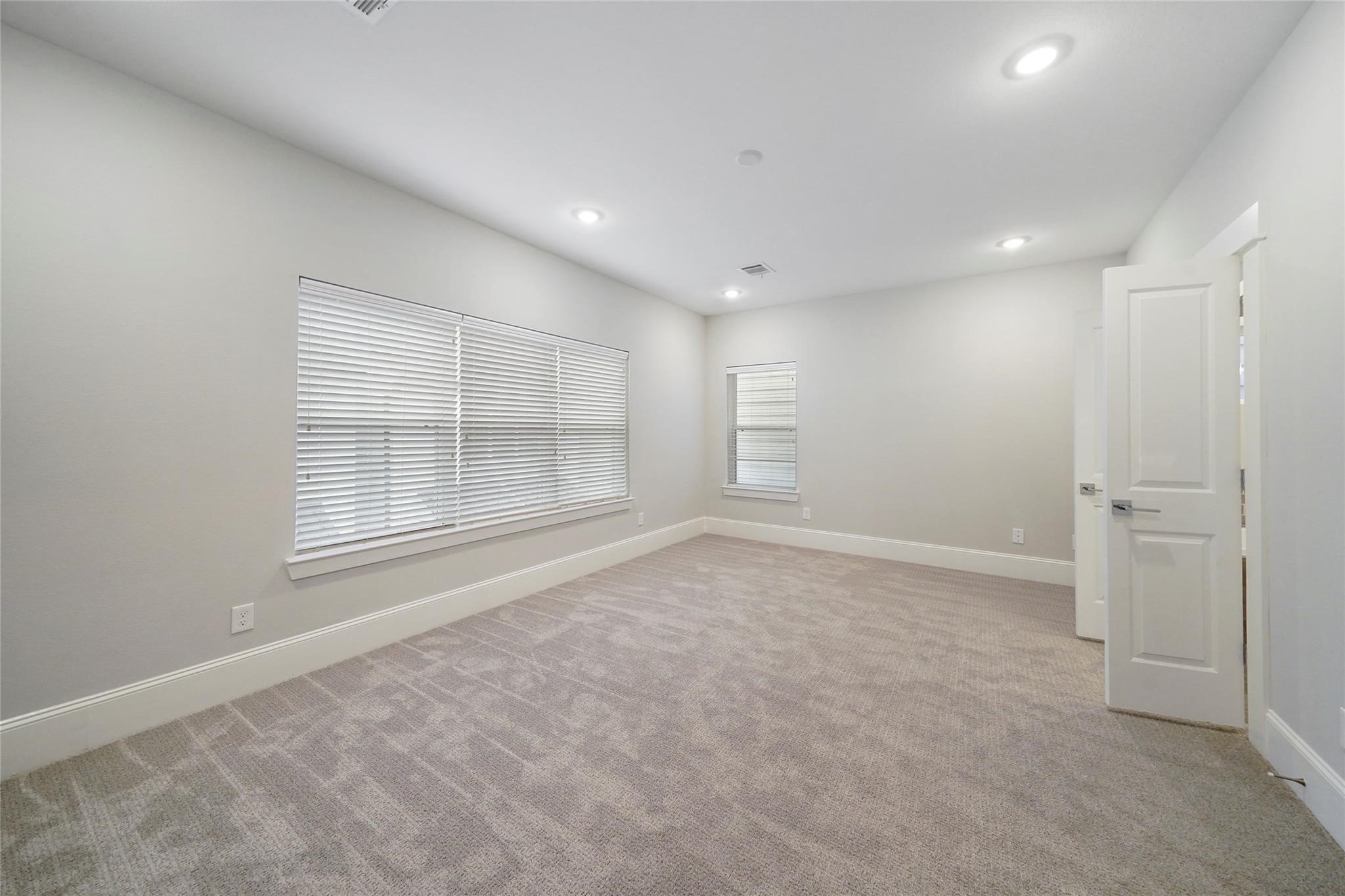1268 North Post Oak Road, Unit A Houston, TX 77055 - Photo 24 of 32 an empty room with windows and closet