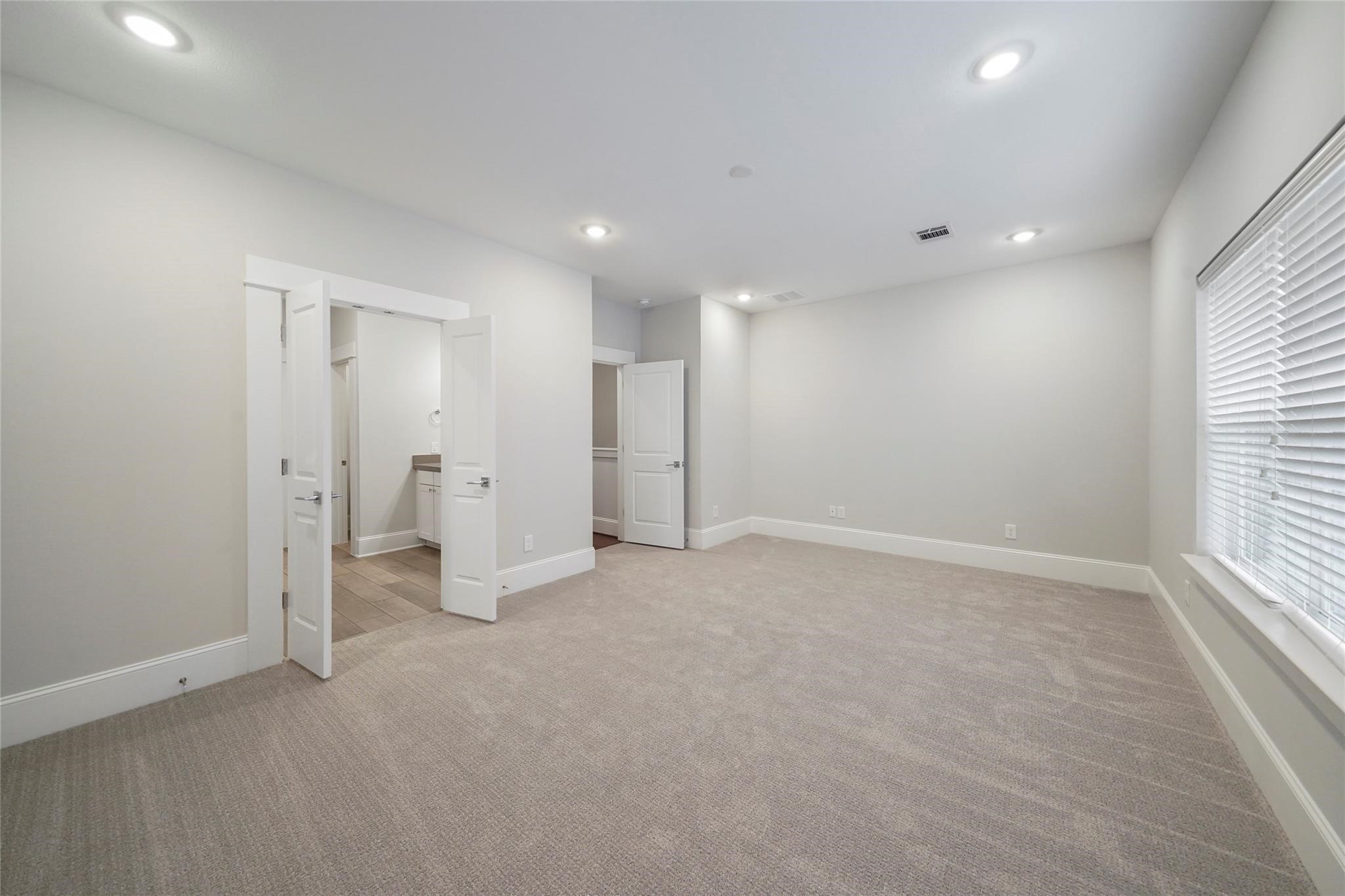 1268 North Post Oak Road, Unit A Houston, TX 77055 - Photo 25 of 32 an empty room with a cabinet and a window