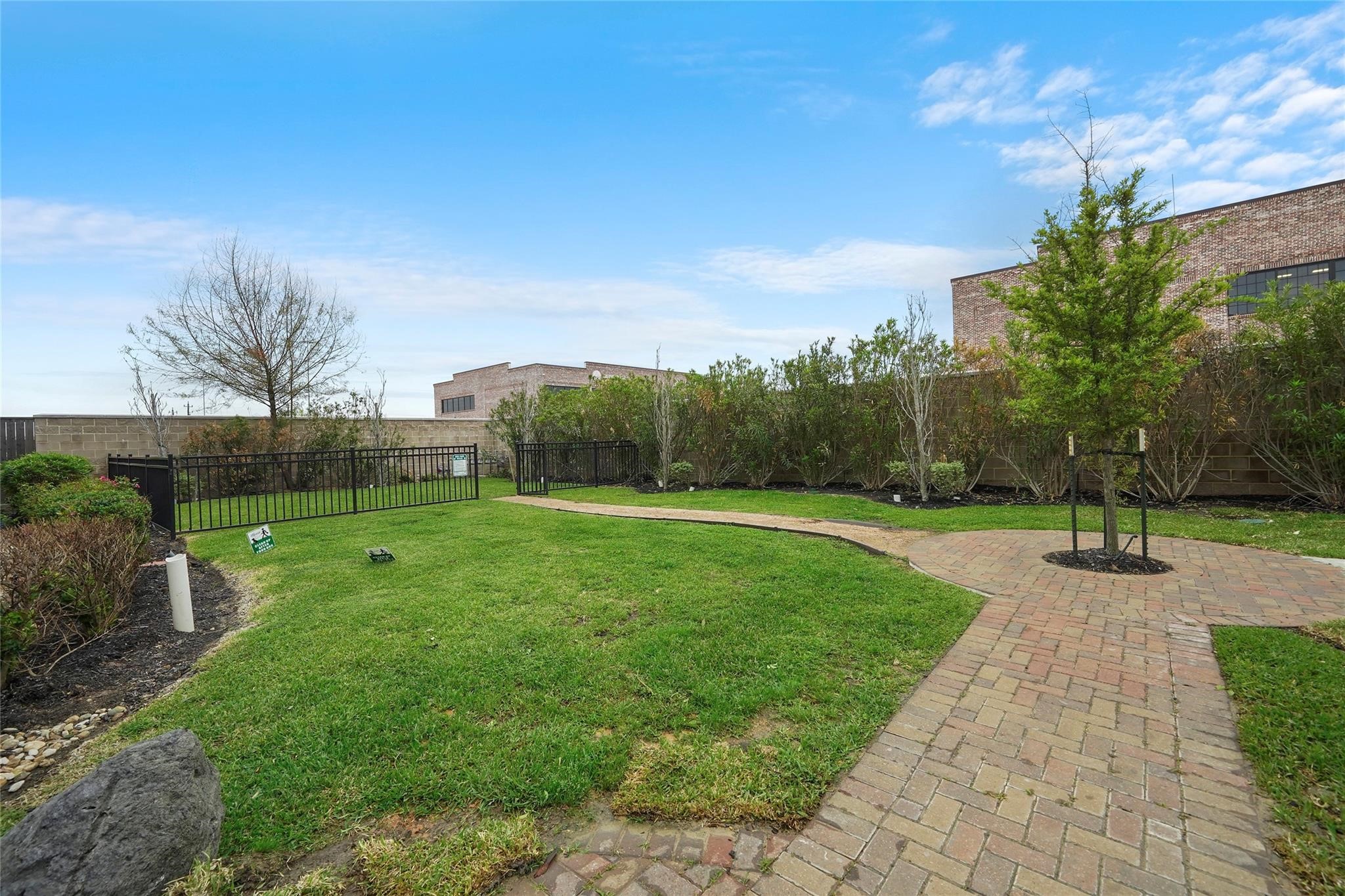 1268 North Post Oak Road, Unit A Houston, TX 77055 - Photo 30 of 32 a view of a garden with plants and trees