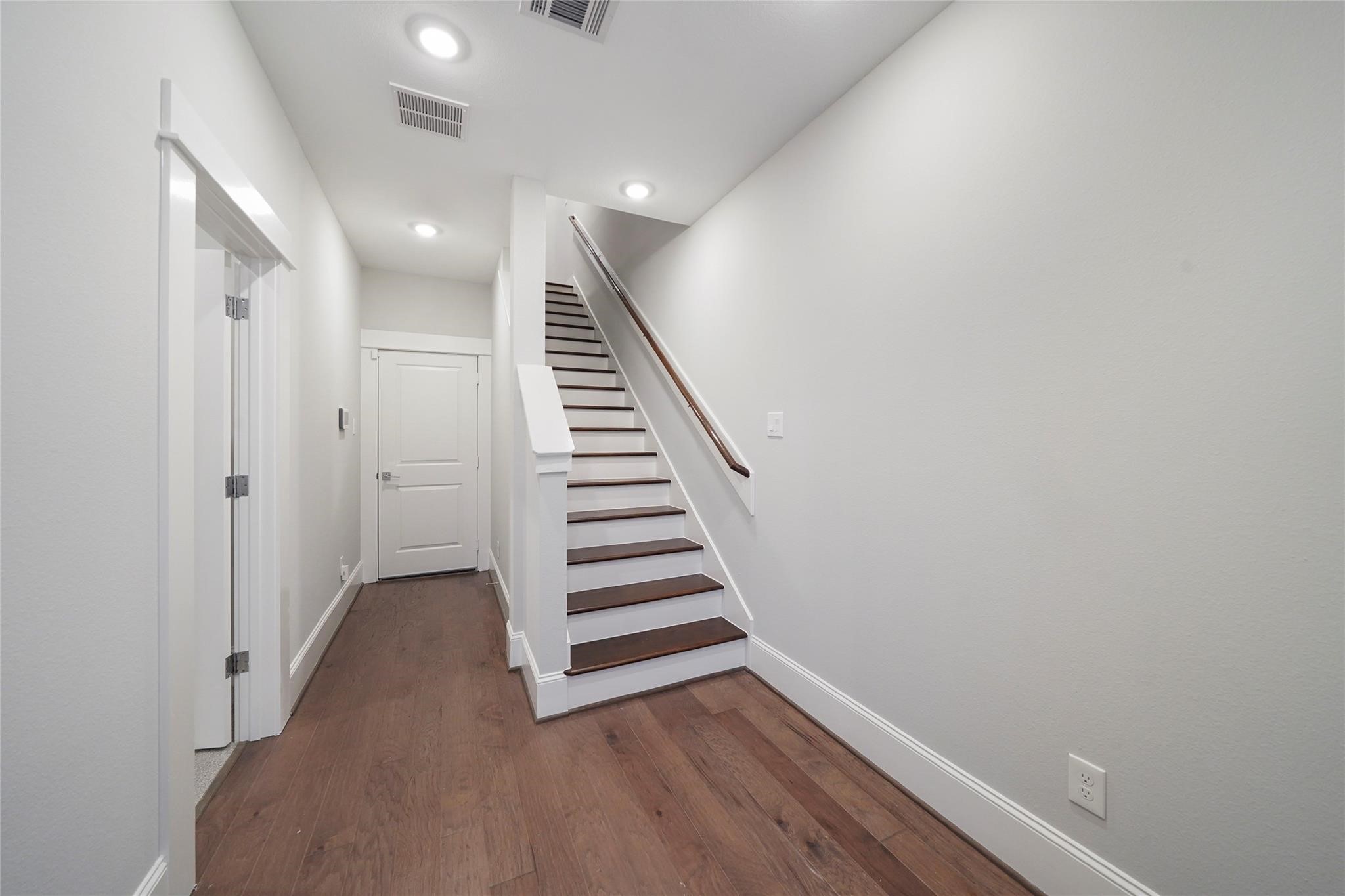1268 North Post Oak Road, Unit A Houston, TX 77055 - Photo 3 of 32 a view of a hallway with wooden floor and entryway