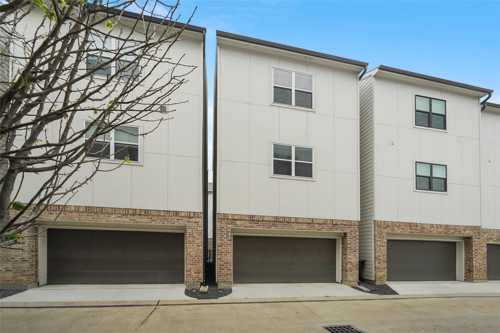1268 North Post Oak Road, Unit A Houston, TX 77055 - Photo 31 of 32 a front view of a house with garage