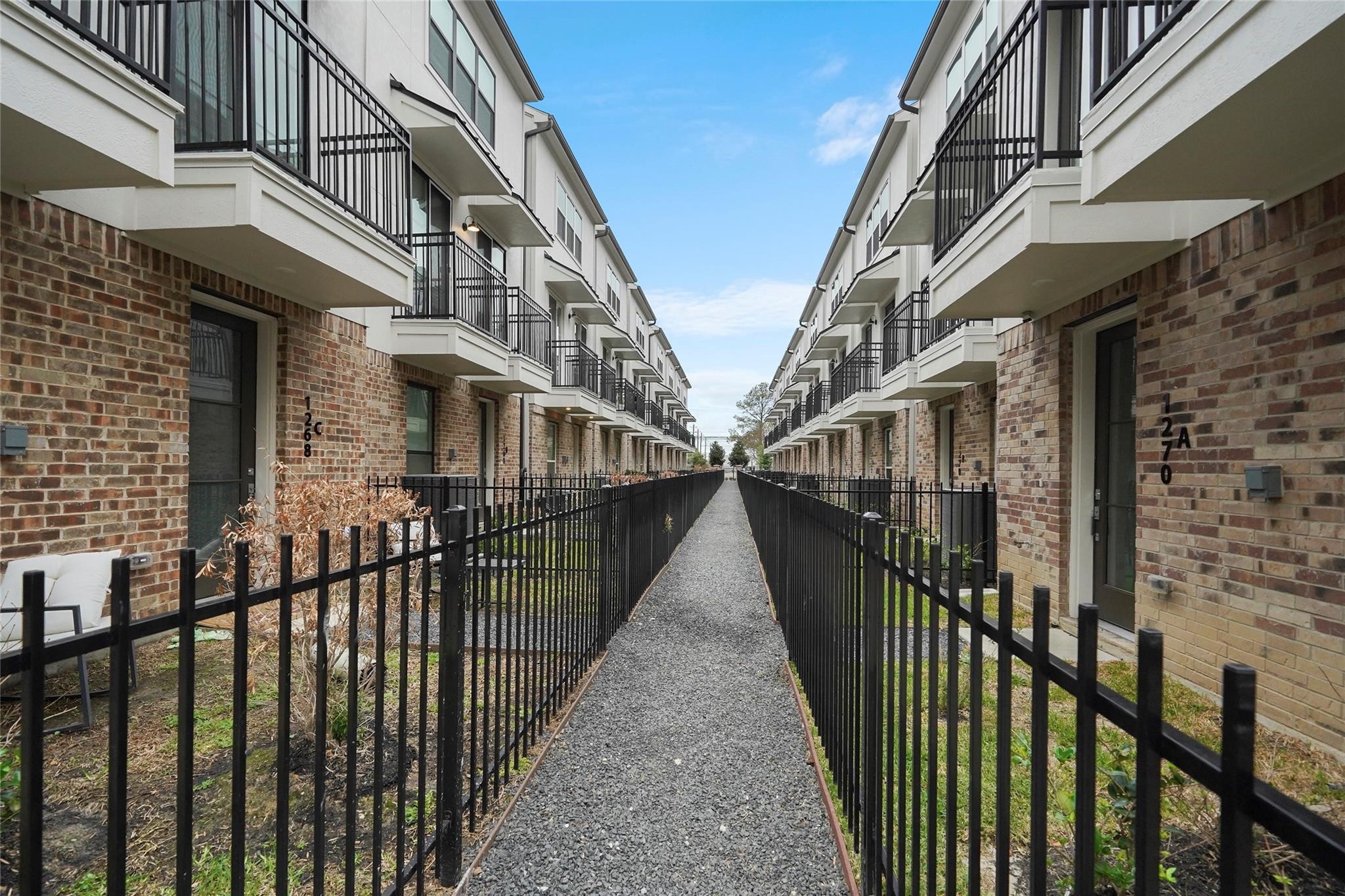 1268 North Post Oak Road, Unit A Houston, TX 77055 - Photo 32 of 32 a view of a house with wooden stairs