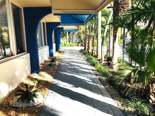 a view of path along with potted plant