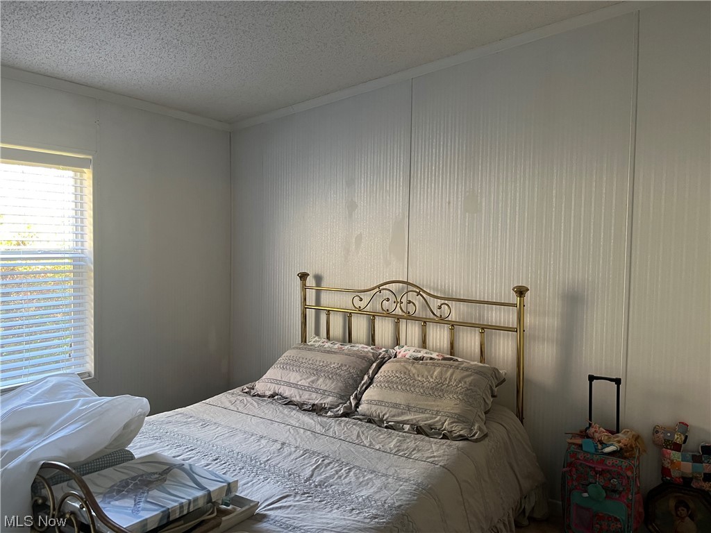 2885 Virginia Ridge Road Philo, OH 43771 - Photo 13 of 23 Bedroom featuring a textured ceiling