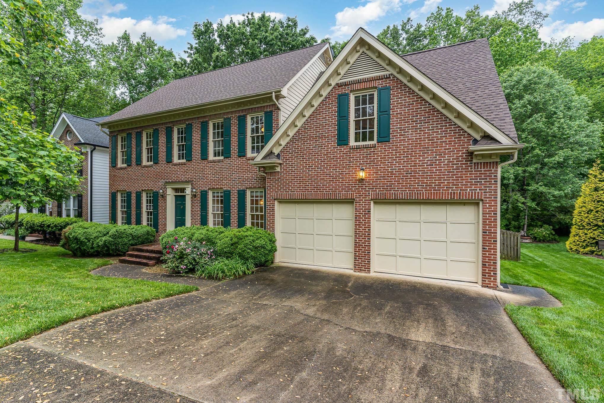 8121 Glenbrittle Way Raleigh, NC 27615 - Photo 2 of 35 a front view of a house with a yard