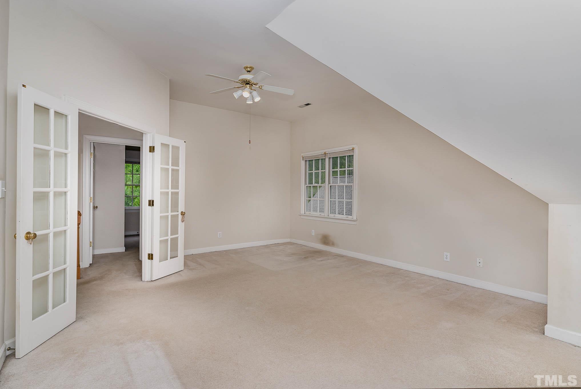 8121 Glenbrittle Way Raleigh, NC 27615 - Photo 24 of 35 an empty room with windows and closet