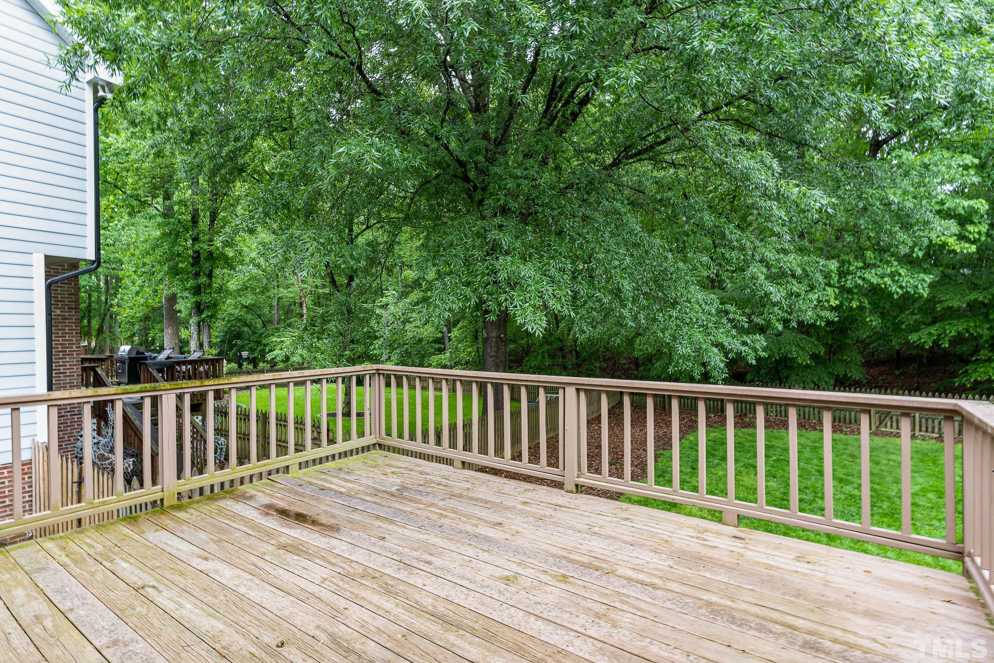 8121 Glenbrittle Way Raleigh, NC 27615 - Photo 26 of 35 a view of balcony with wooden floor and fence