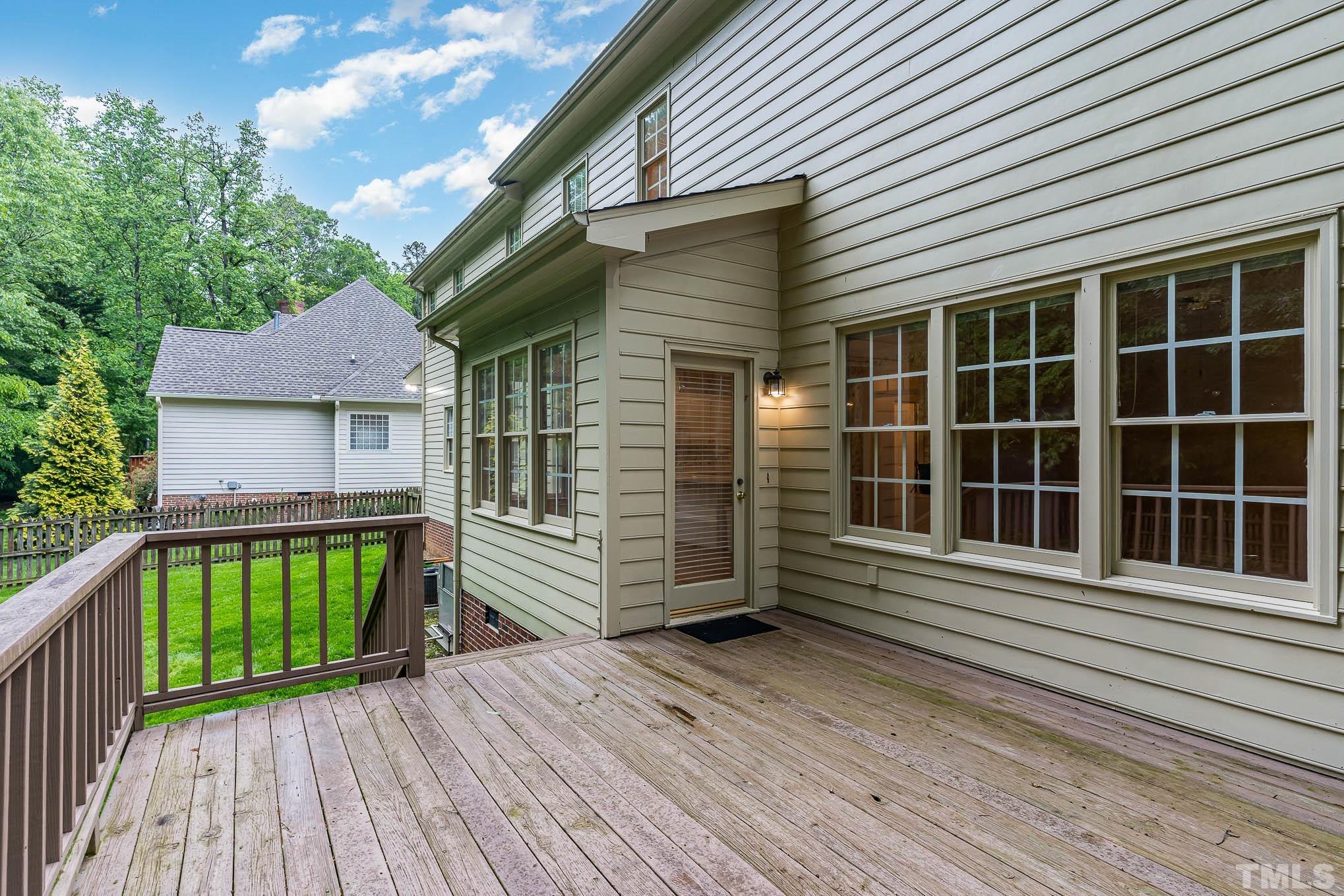8121 Glenbrittle Way Raleigh, NC 27615 - Photo 27 of 35 a view of front door of house with deck