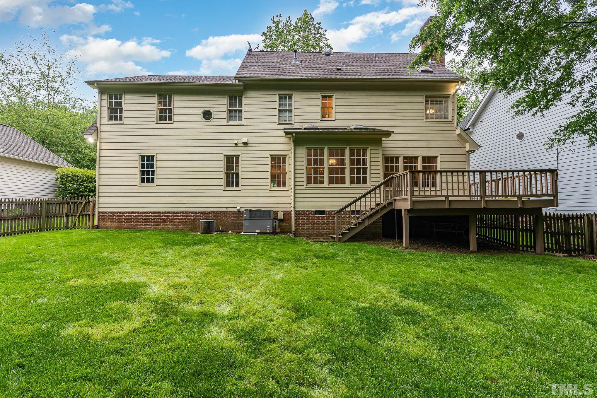 8121 Glenbrittle Way Raleigh, NC 27615 - Photo 28 of 35 a front view of a house with garden