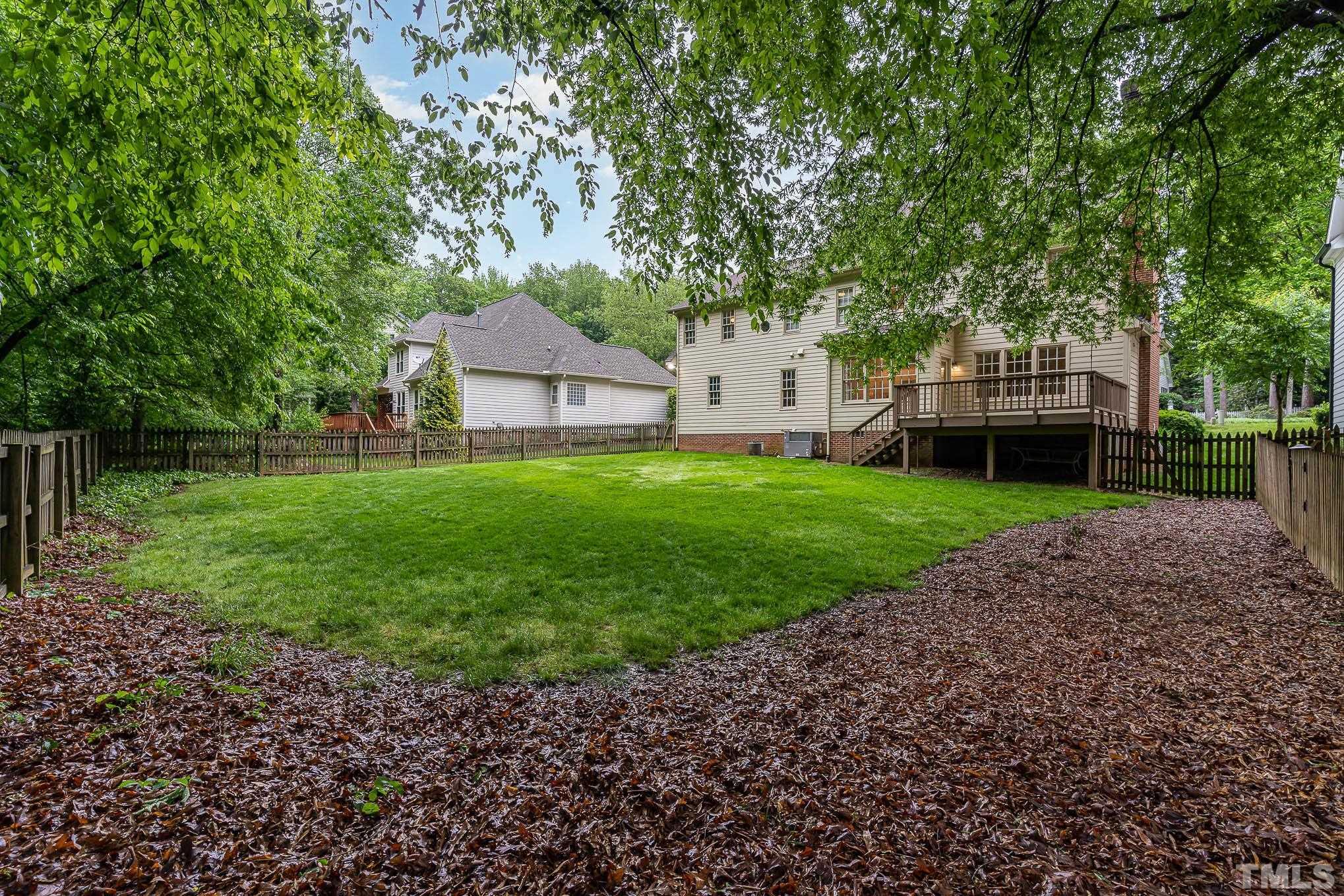 8121 Glenbrittle Way Raleigh, NC 27615 - Photo 29 of 35 a front view of a house with garden
