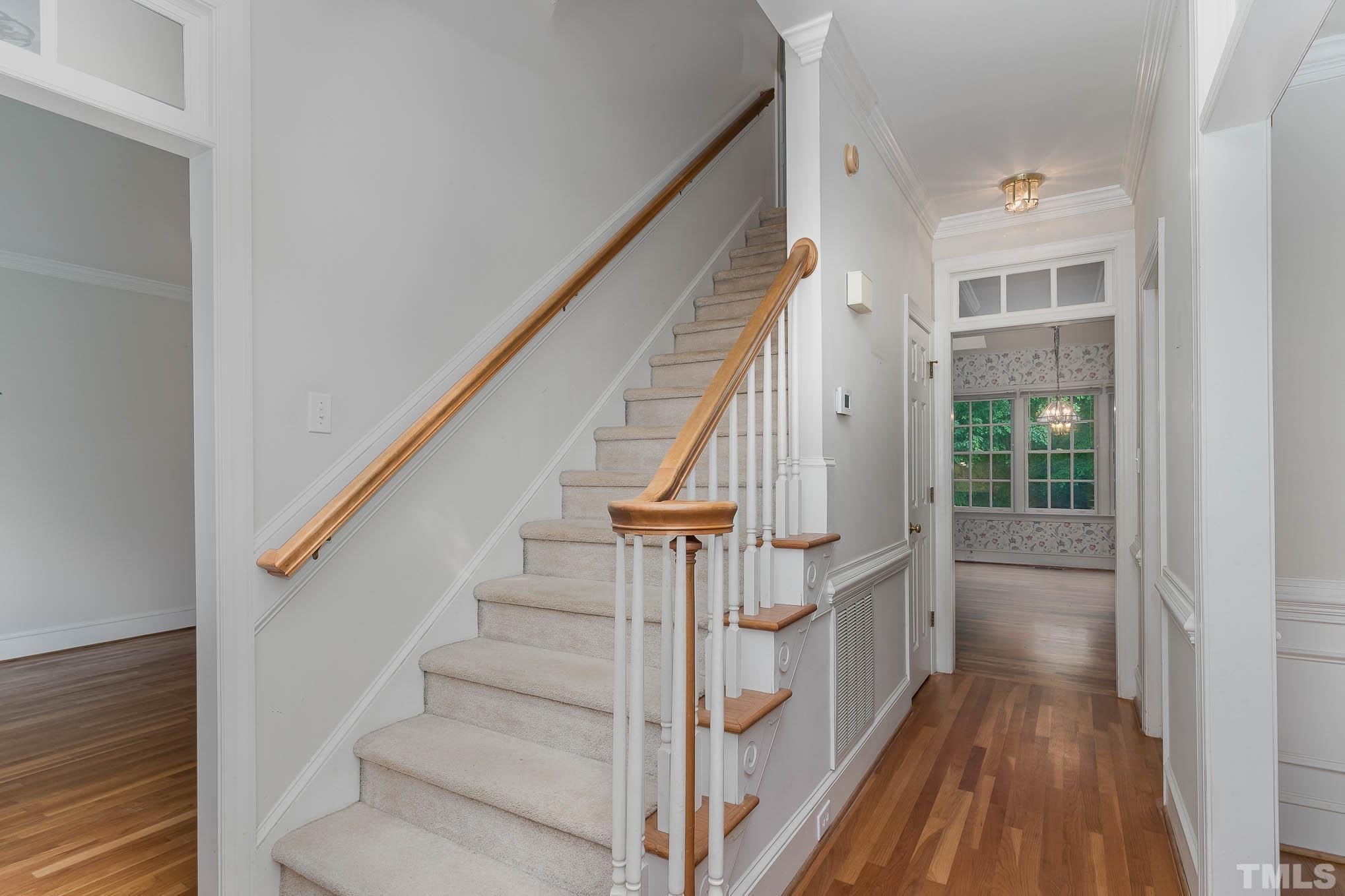 8121 Glenbrittle Way Raleigh, NC 27615 - Photo 4 of 35 a view of entryway and hall with wooden floor