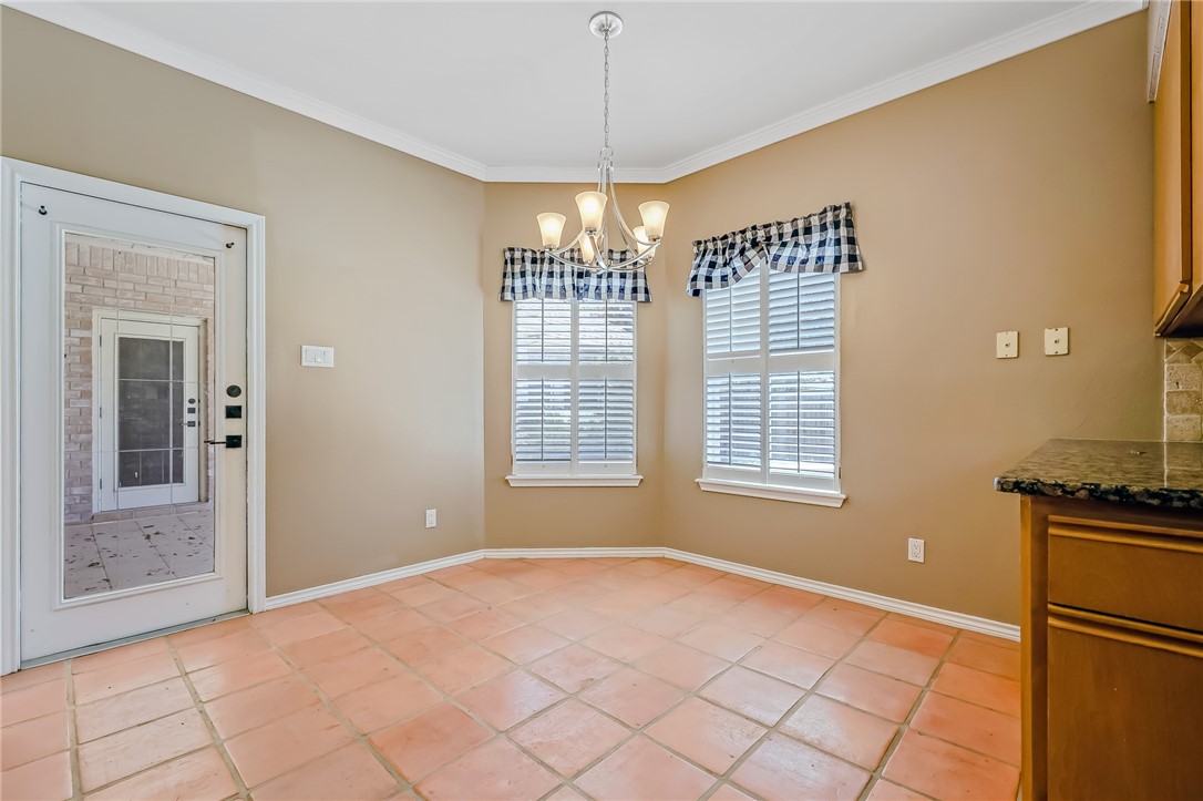5917 Harvest Hill Road Corpus Christi, TX 78414 - Photo 17 of 40 a view of an empty room with window and chandelier