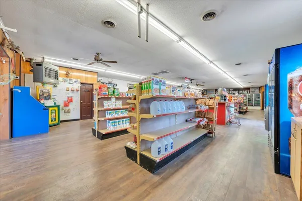 a view of a kitchen with a sink and cabinets