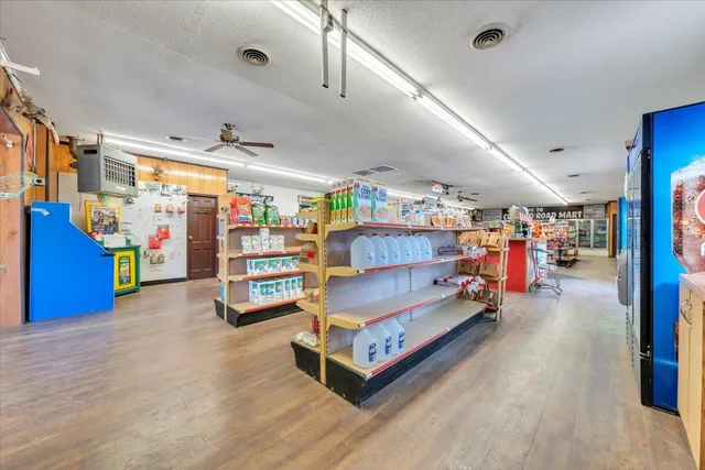 a view of a kitchen with a sink and cabinets