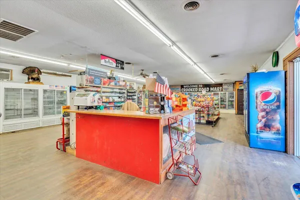 a kitchen with a refrigerator a sink and cabinets