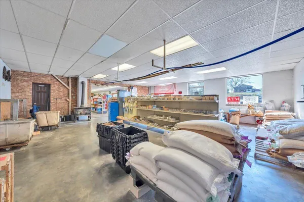 a view of a livingroom with a ceiling fan and window