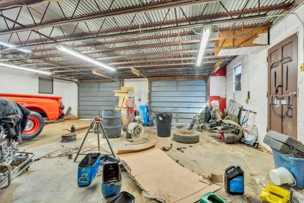 a view of a brick house with a wooden fence