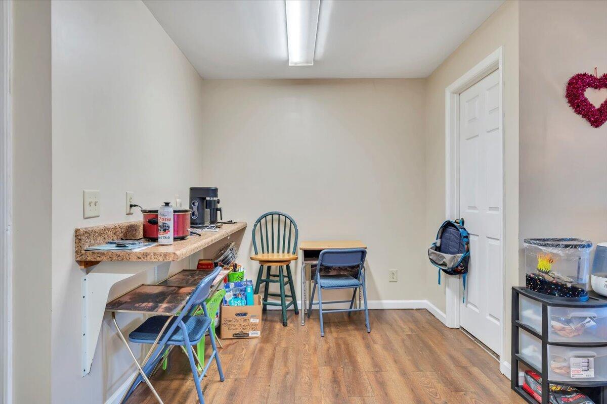 14189 Franklin Street Ferrum, VA 24088 - Photo 58 of 95 a view of a dining room with furniture wooden floor and a rug