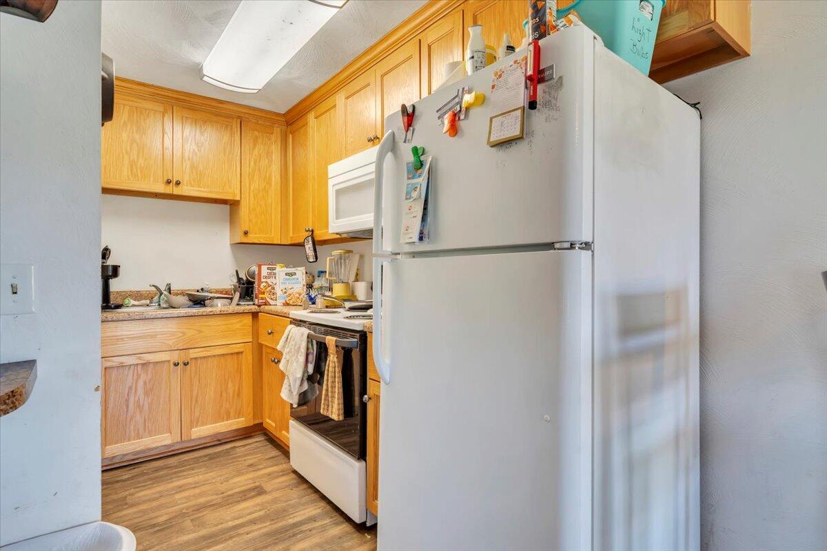 14189 Franklin Street Ferrum, VA 24088 - Photo 63 of 95 a kitchen with a refrigerator a sink and cabinets
