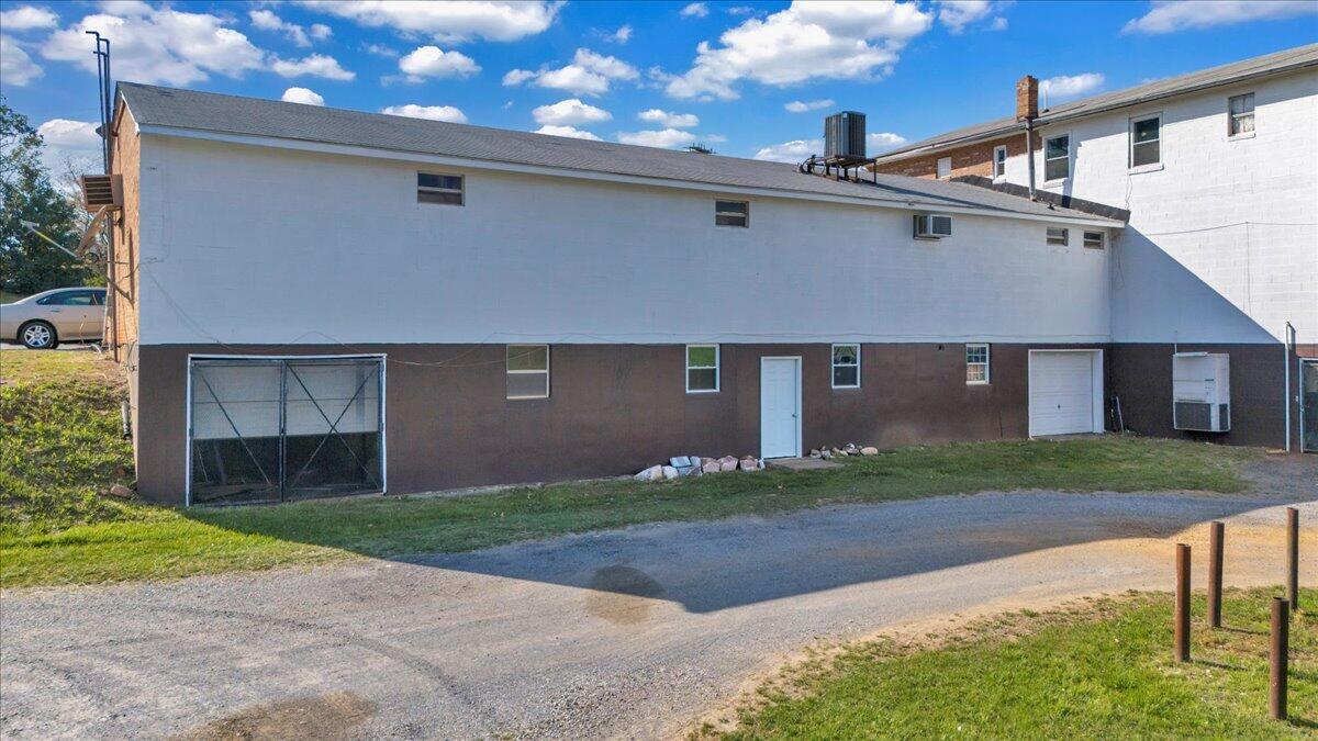 14189 Franklin Street Ferrum, VA 24088 - Photo 7 of 95 a front view of a house with a yard and garage