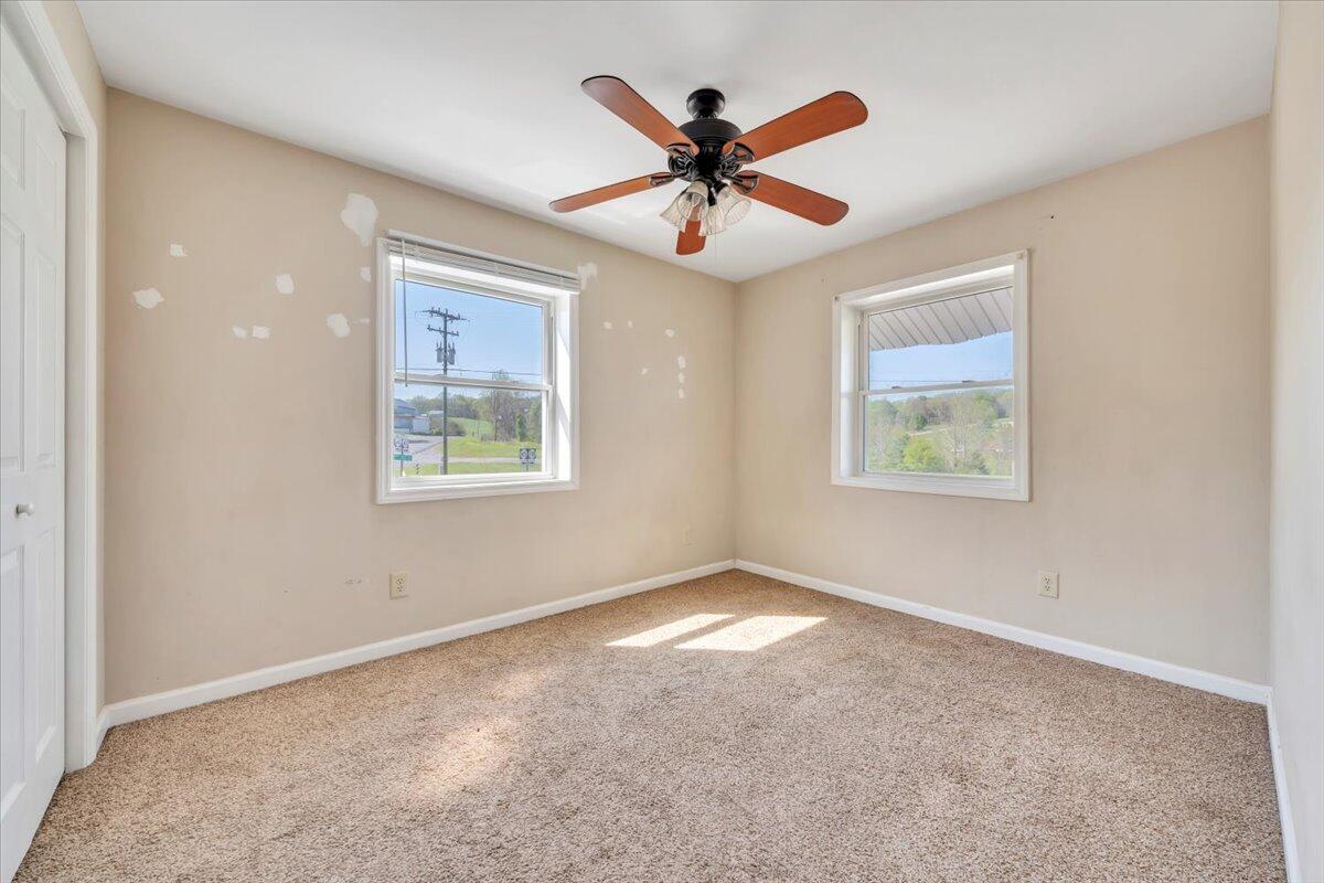 14189 Franklin Street Ferrum, VA 24088 - Photo 72 of 95 a view of a big room with wooden floor and windows