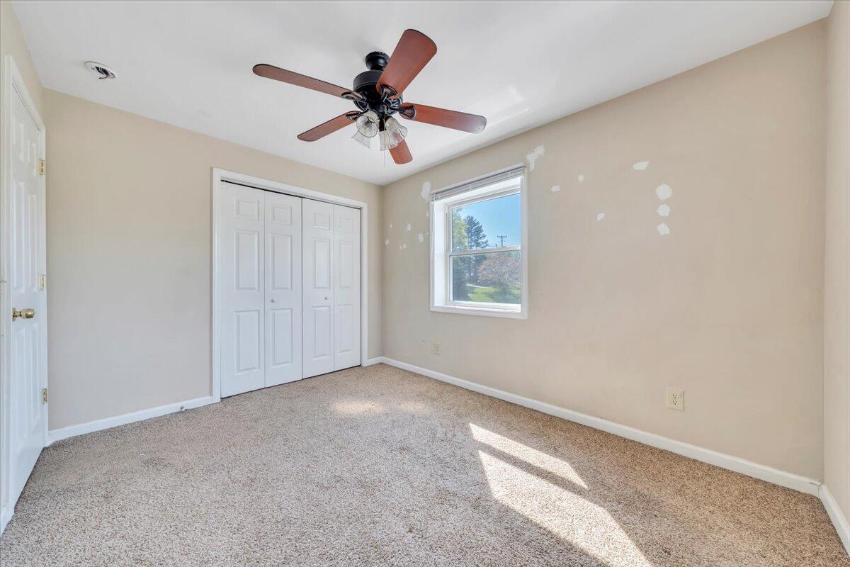 14189 Franklin Street Ferrum, VA 24088 - Photo 73 of 95 a view of a livingroom with a ceiling fan and window