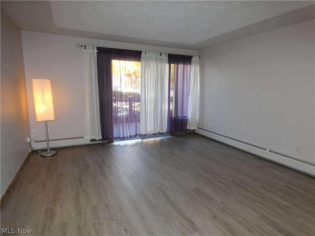 The luxury vinyl plank flooring provides that clean and neutral palette.  The sliders open to the maintenance free deck.