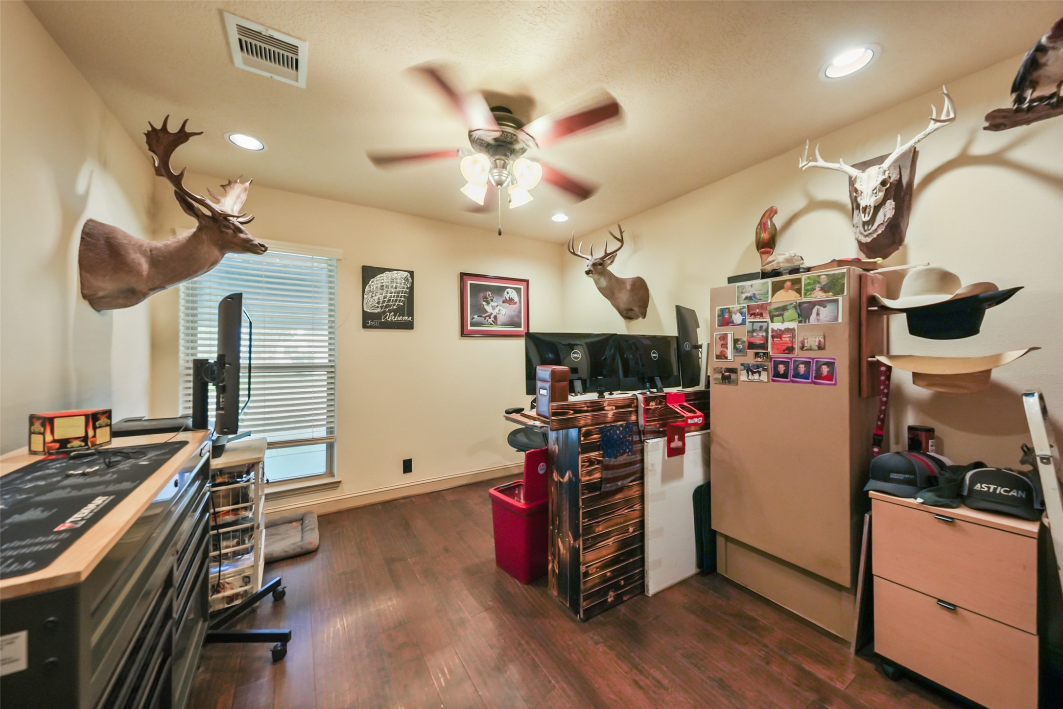 34366 Owens Road Hempstead, TX 77445 - Photo 17 of 46 Spacious secondary bedroom featuring durable flooring, a ceiling fan, generous closet space, and flexible room for family, guests, or a home office.