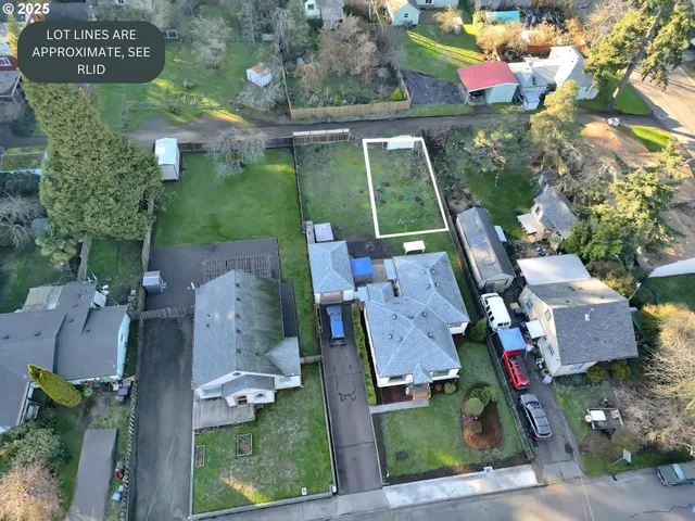 an aerial view of residential house with outdoor space and parking
