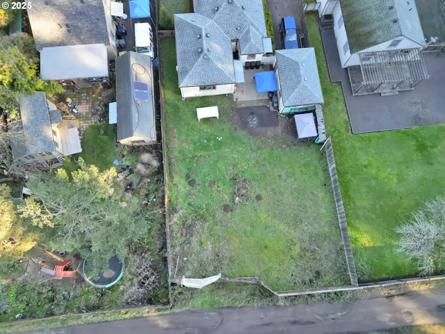 an aerial view of residential house with outdoor space