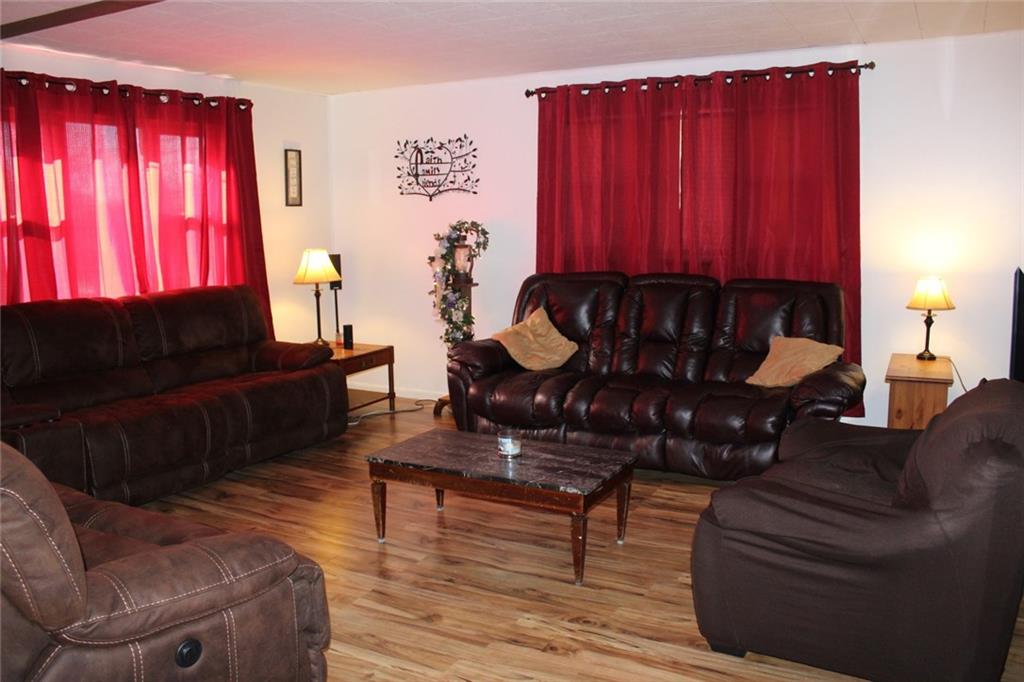2050 Ridge Rd Extension Ambridge, PA 15003 - Photo 2 of 8 As you enter this home, the spacious living room invites you to relax.
