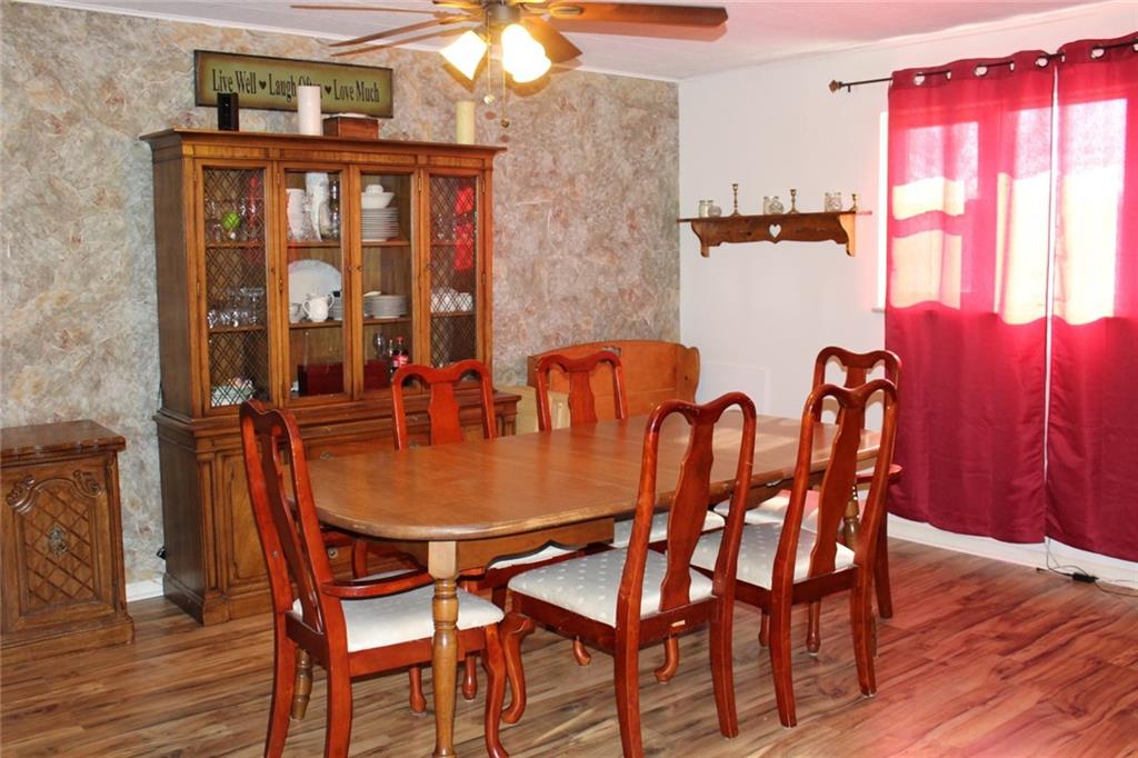 2050 Ridge Rd Extension Ambridge, PA 15003 - Photo 3 of 8 Entertain your guests in the dining room just steps away from the eat-in kitchen.