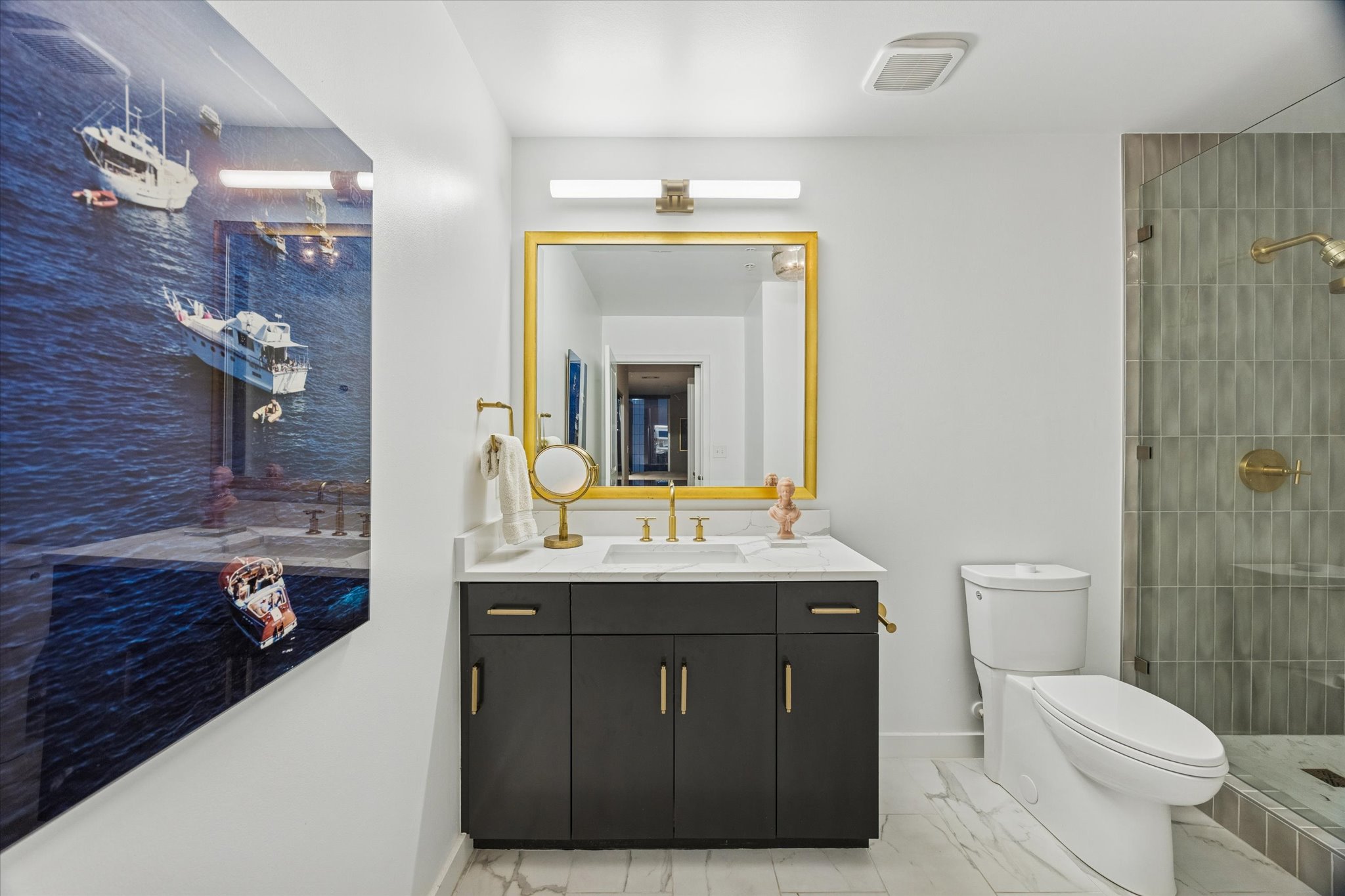 360 Nueces Street, Unit 1417 Austin, TX 78701 - Photo 20 of 39 a bathroom with a granite countertop sink a toilet and a mirror