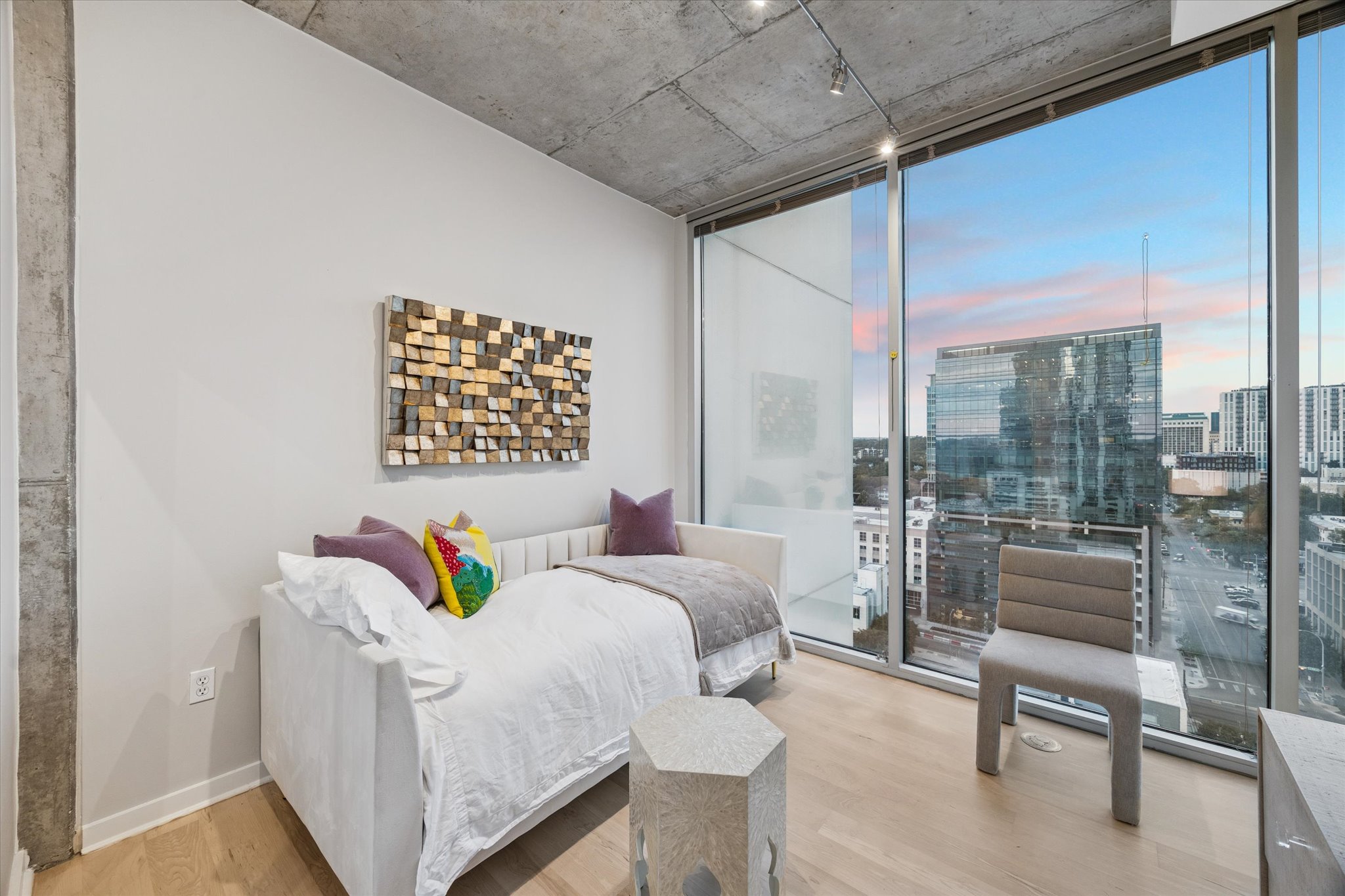 360 Nueces Street, Unit 1417 Austin, TX 78701 - Photo 23 of 39 a bedroom with a bed and a couch